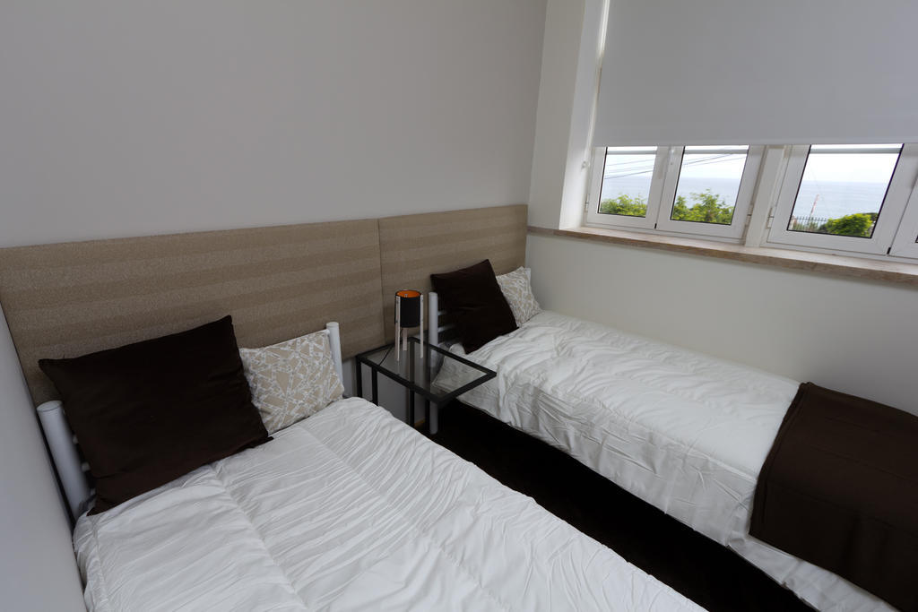 ホテル Turismo Do Seculo エストリル 部屋 写真 A bedroom